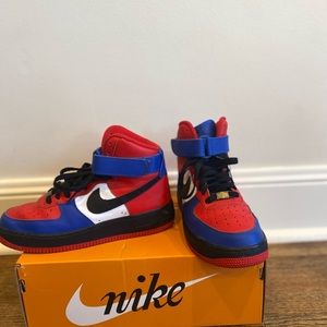 Nike Air Force 1 high tops blue and red Nike’s.
